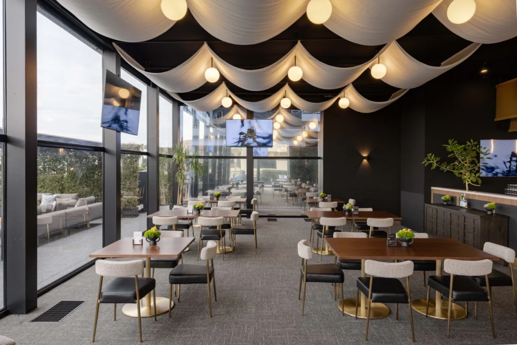 Bobby Berk Genesis Invitational Skybox lounge seating